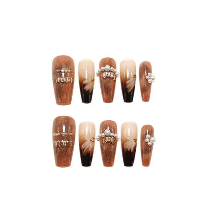 Artificial nails with glamorous gold and pearl embellished accents Kalsten