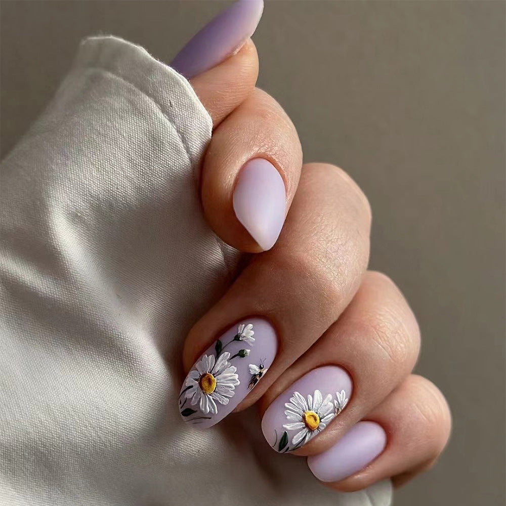 Artistic nail design with delicate floral elements Kalsten