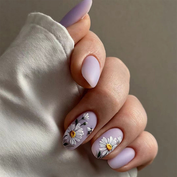 Artistic nail design with delicate floral elements Kalsten