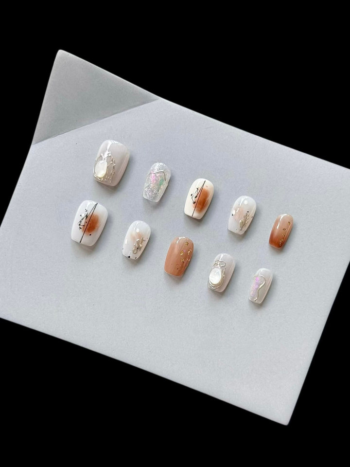 Artistic Press-On Nail Art Set with Geometric and Floral Embellishments