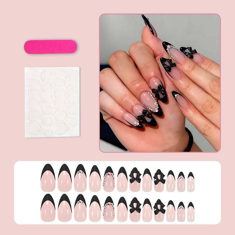 Artificial nail set with glamorous bow design and sparkling accents Kalsten
