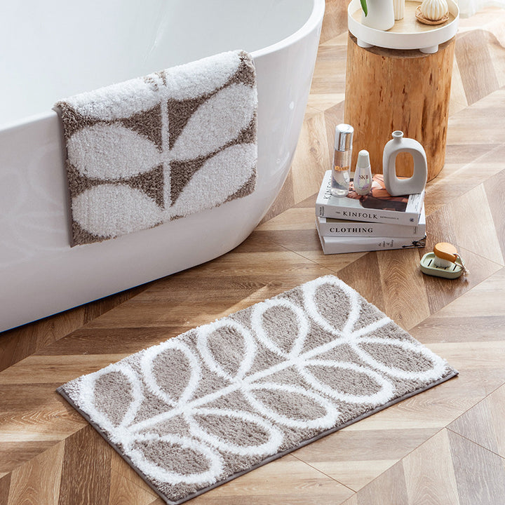 Fluffy bath mat with abstract wave pattern and non-slip back