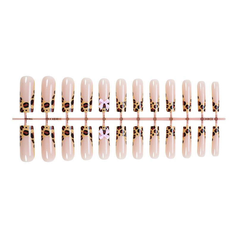 Decorative Stiletto Press-On Nail Art with Animal Print and Bow Accents kalsten