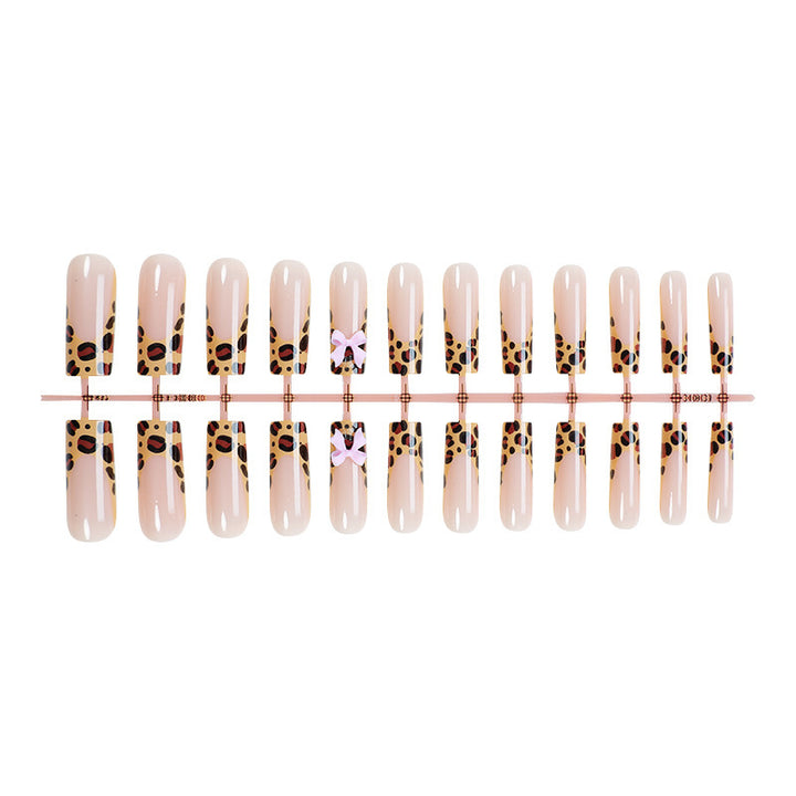 Decorative Stiletto Press-On Nail Art with Animal Print and Bow Accents kalsten