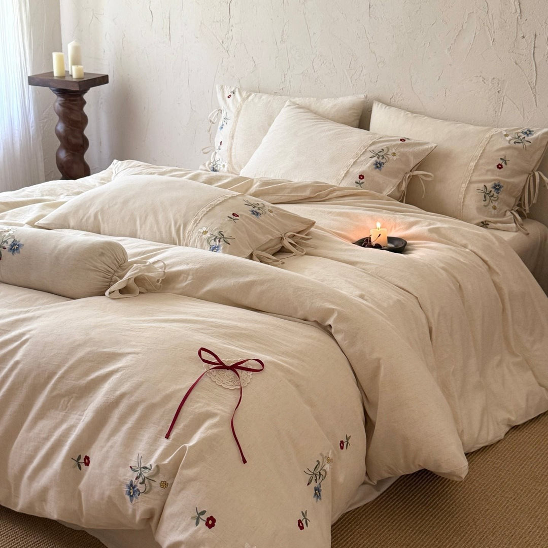 Bedding set made of linen look with floral embroidery and bow closure
