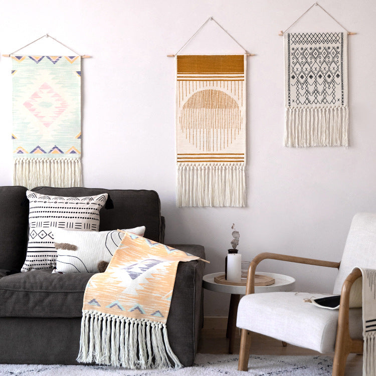 Handcrafted cotton tapestry wall decoration with macrame fringes and geometric circle motif