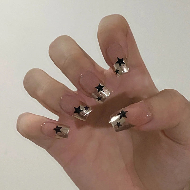 Artful nail design with star accents Kalsten