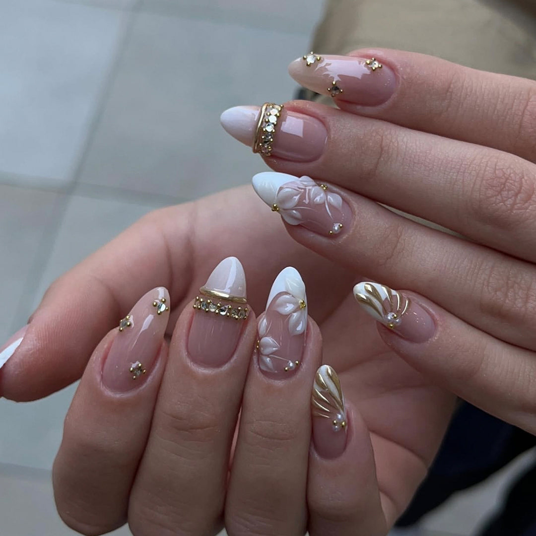 Artful nail art with floral and rhinestone accents Kalsten