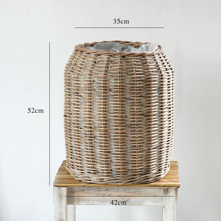 Stylish laundry basket made of braided natural material Kalsten