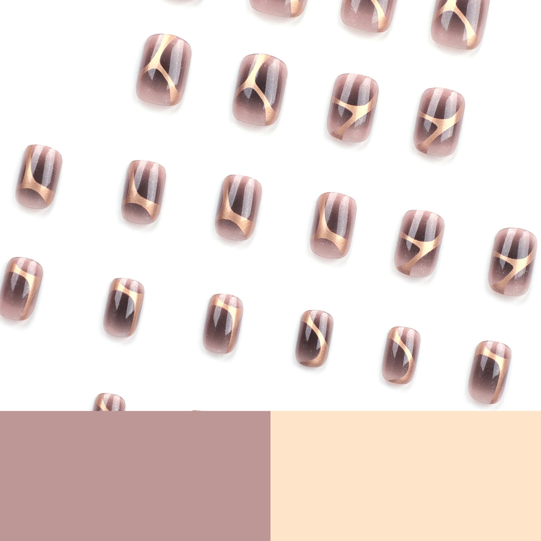 Artificial nail art with elegant metallic design and glitter accents Kalsten