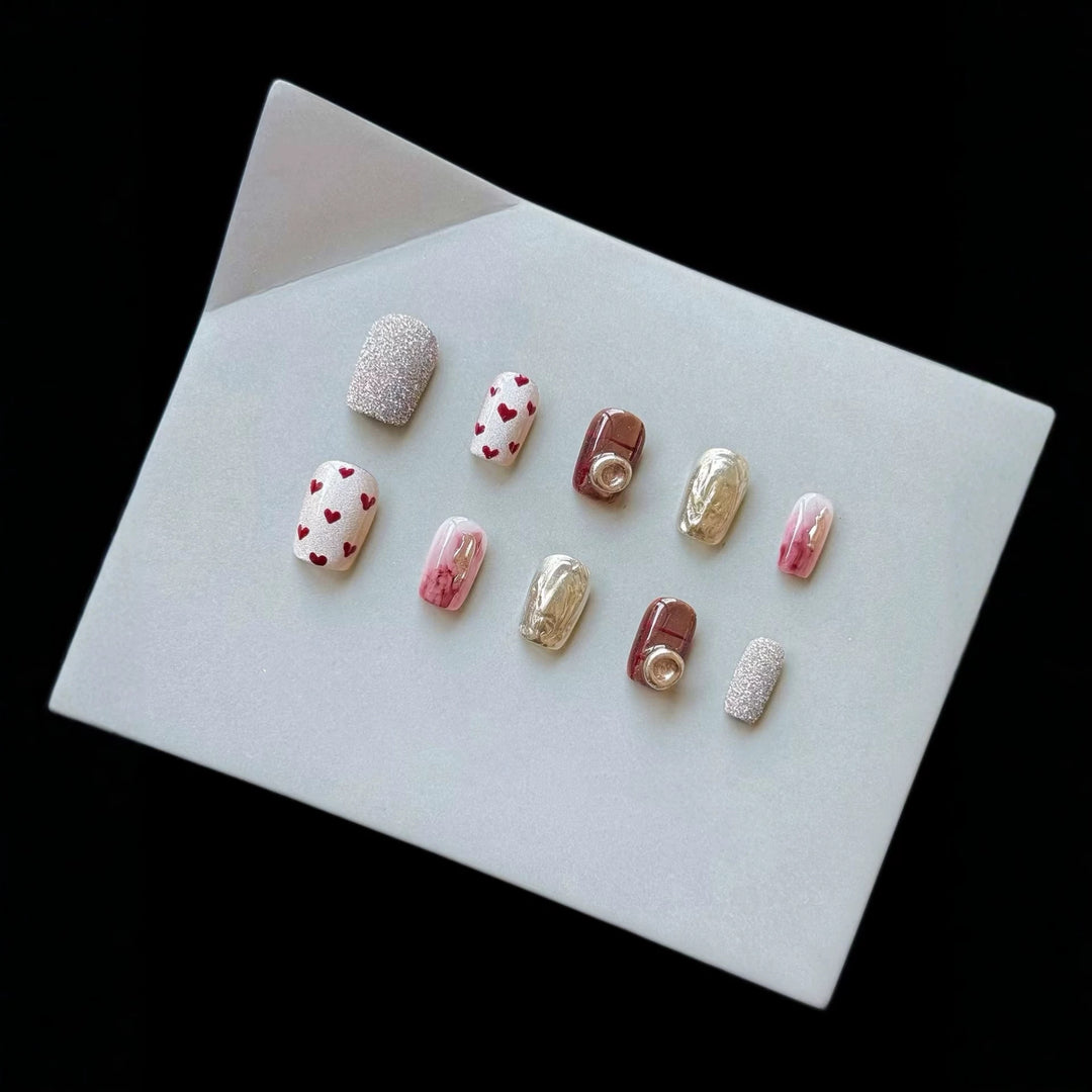 Artistic Press-On Nail Set with Heart and Glitter Accents