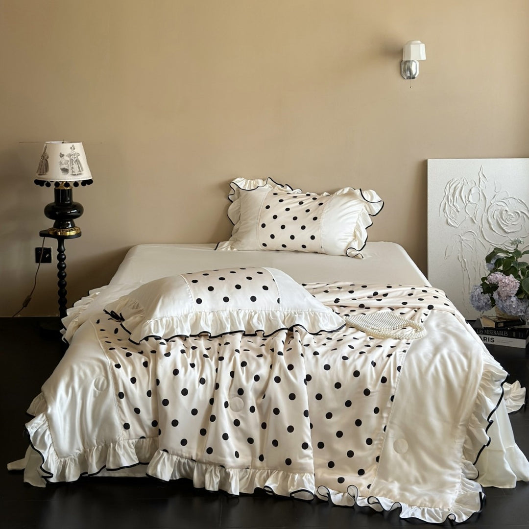 Elegant satin bedding set with polka dot pattern, ruffle and contrasting edge piping