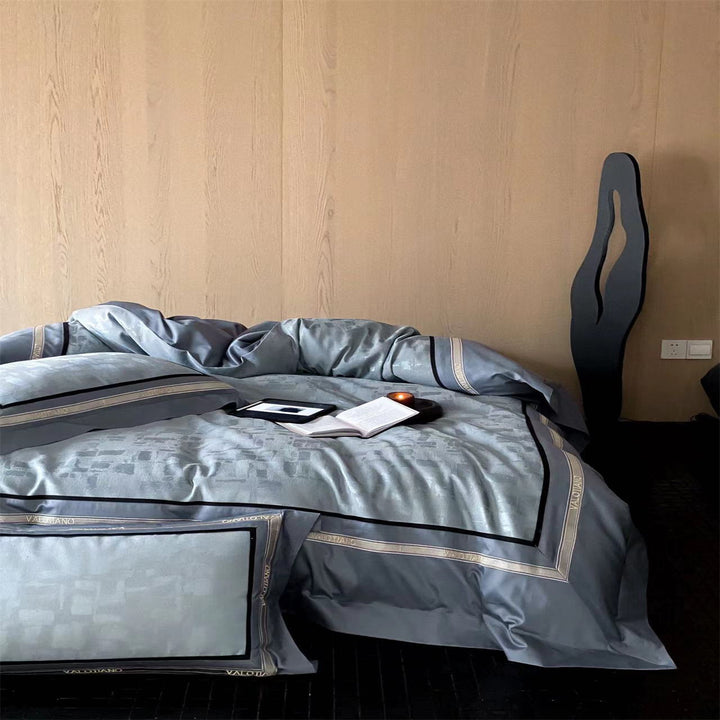 Premium bed set made of heavy cotton satin with woven mosaic relief and double stitched hem