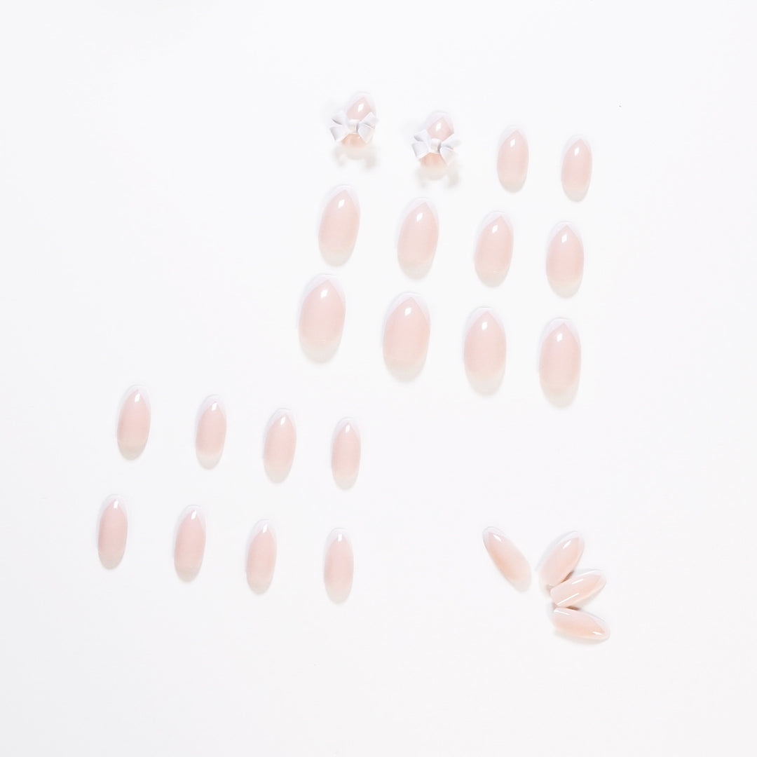 Elegant artificial nails with translucent French tip and decorative floral accents Kalsten