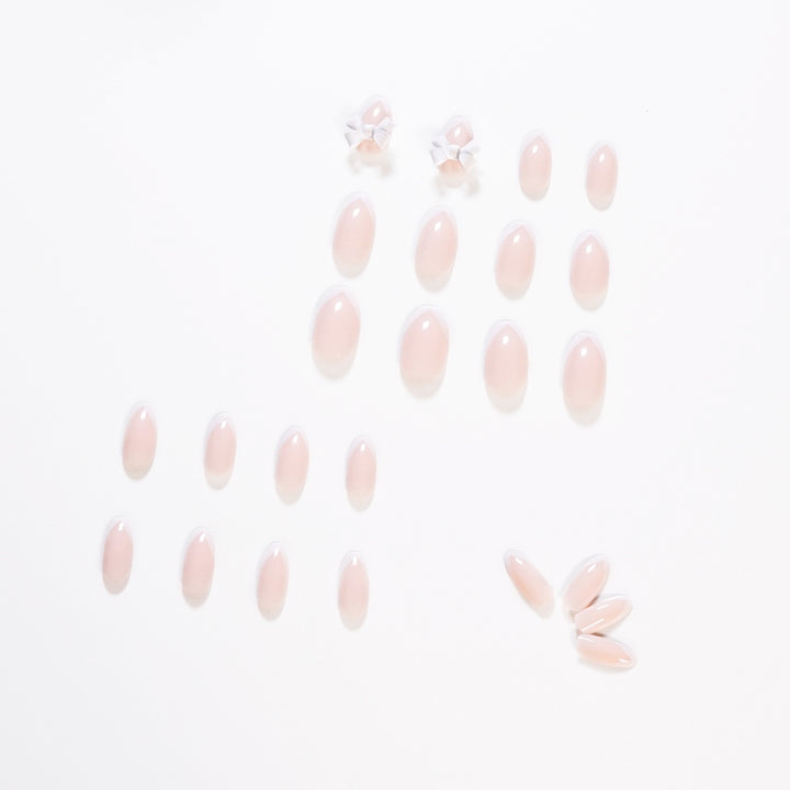 Elegant artificial nails with translucent French tip and decorative floral accents Kalsten