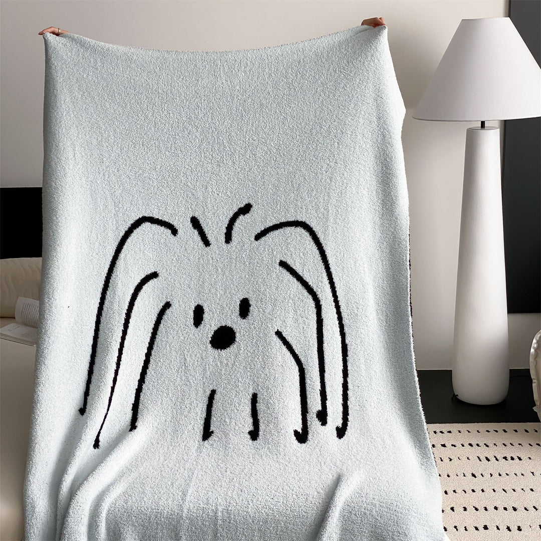Reversible cuddly blanket made of terry cloth with decorative dog motif
