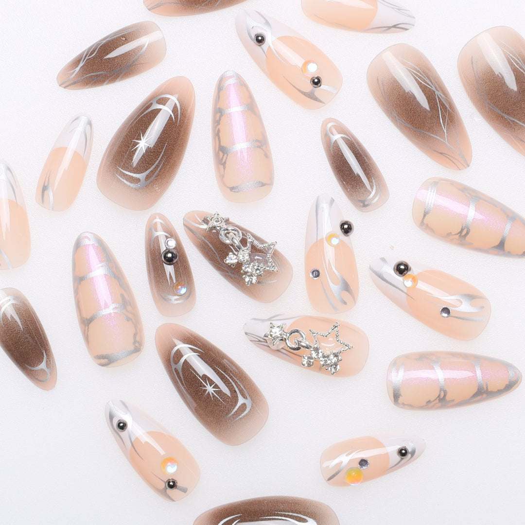Artistic Stiletto Nail Extensions with Metallic Accents Kalsten