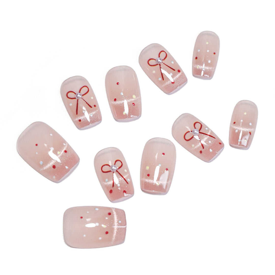 Artificial nail art with elegant bows and glitter accents Kalsten