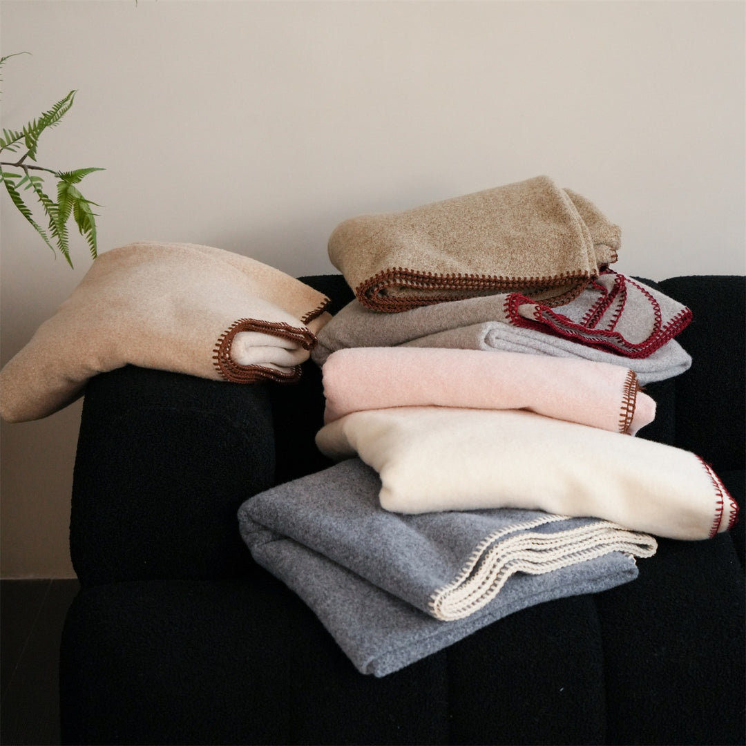Premium wool blanket with fine hand-stitched edge and particularly soft drape