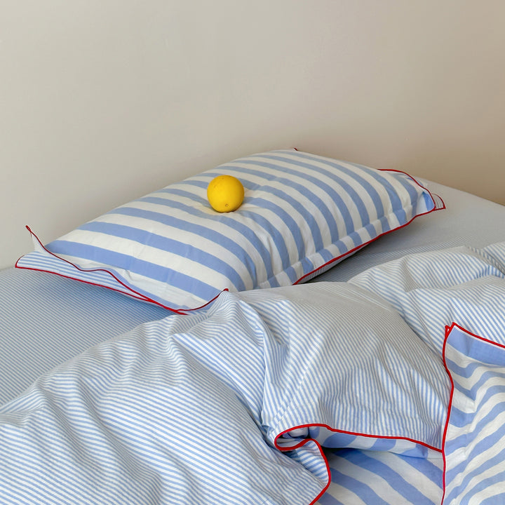 Striped duvet cover and pillowcase set with contrast piping