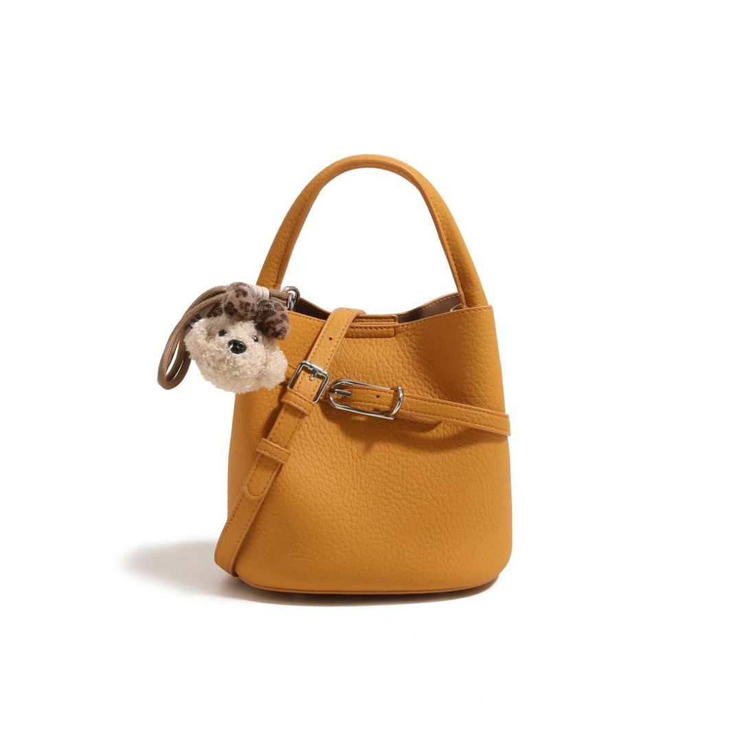 Chic Pebbled Leather Handbag with Cute Charm