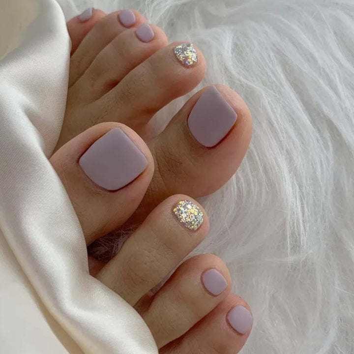 Artful toenail design with glamorous glitter accent Kalsten