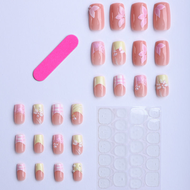 Artificial nails with creative floral designs and glitter accents Kalsten