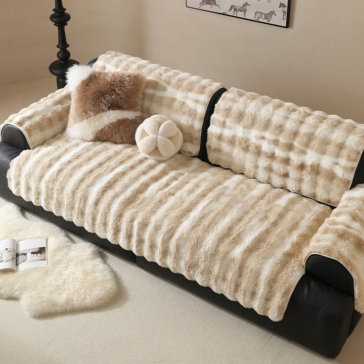 Luxurious sofa cover made of faux fur with ribbed texture