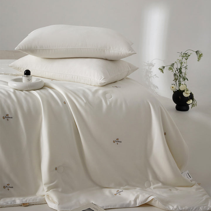 Silk bed cover made of microfiber with subtle embroidery and ultra-light fall