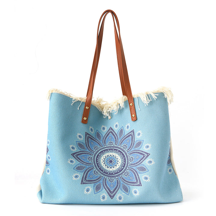 Beach bag with floral pattern and fringes Kalsten