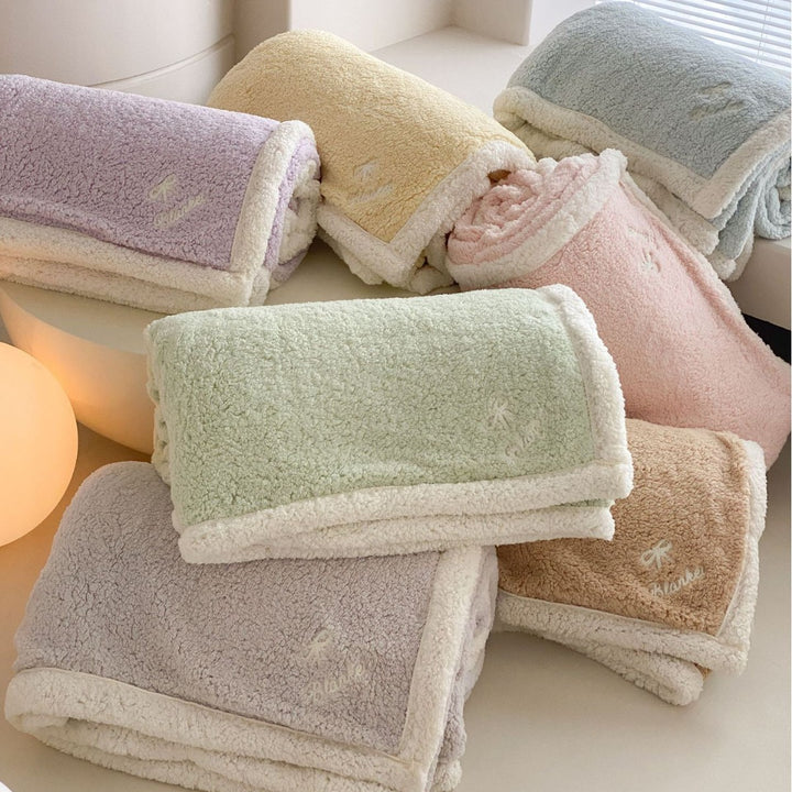 Cozy Sherpa blanket with reversible fleece lining