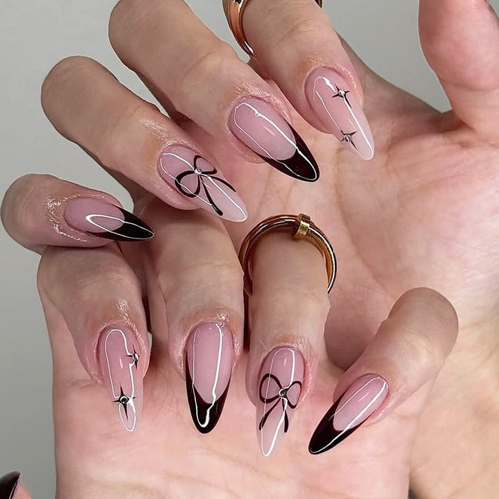 Acrylic nail set with elegant ombre design and creative bow motif Kalsten