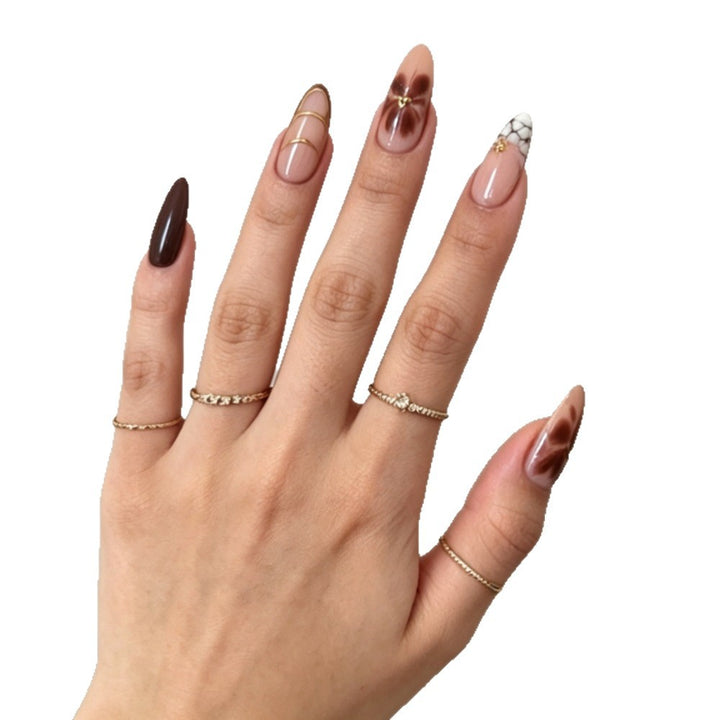 Artificial nails with elegant marble pattern and delicate accents Kalsten