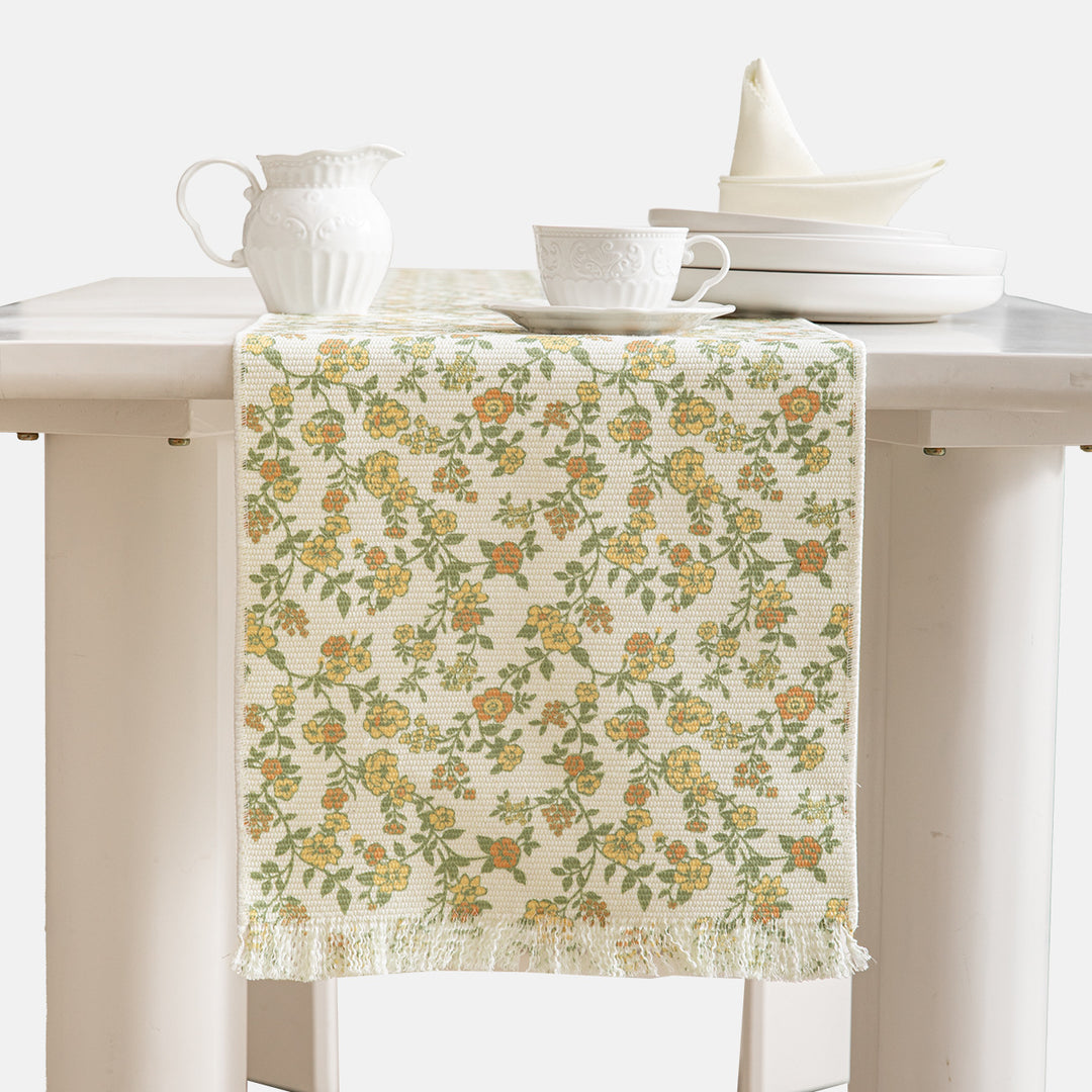 Jacquard table runner with floral vine structure and decorative fringes Kalsten