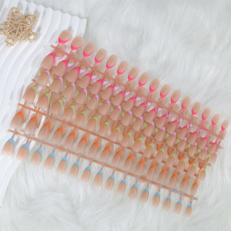 Acrylic nail set with elegant tips and creative color accents Kalsten