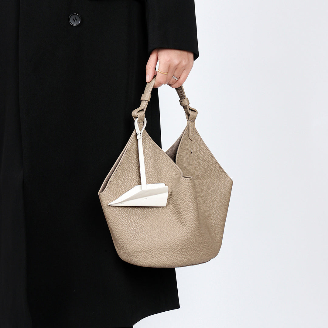 Slouchy Pebbled Leather Hobo Bucket Bag with Top Handle and Geometric Silhouette
