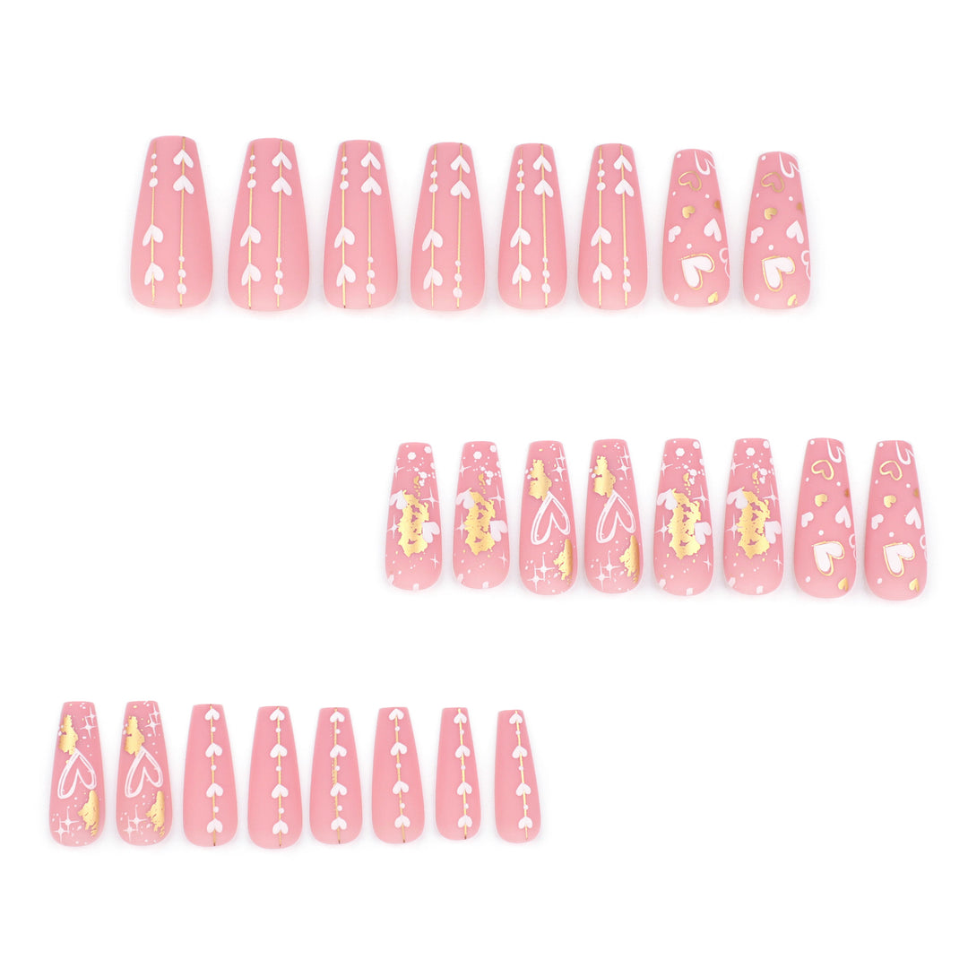 Artificial nail art with heart and glitter designs Kalsten