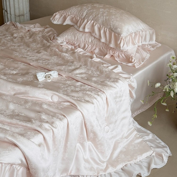 Luxury satin bedding set with floral jacquard pattern, ruffle, and silky finish