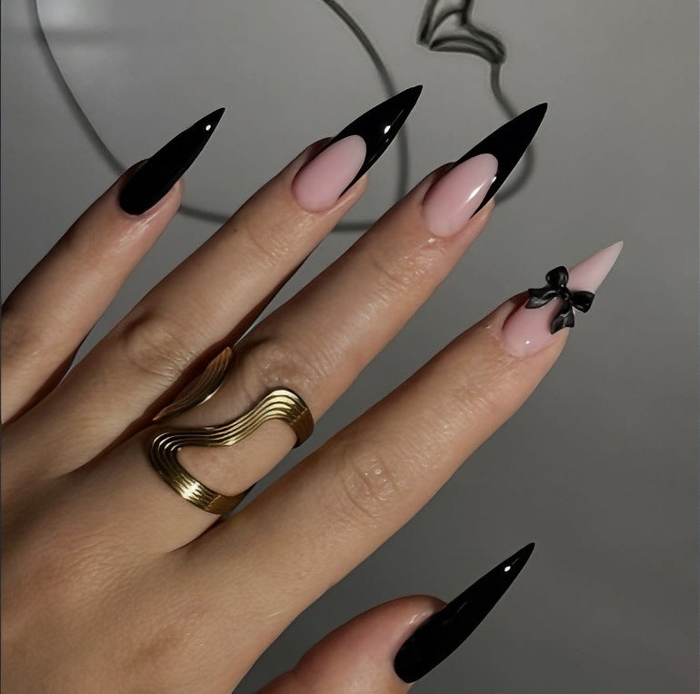 Acrylic nail set with elegant black-and-white design and playful accents Kalsten