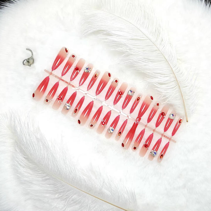 Glamorous artificial nails with sparkling ombre effect and elegant embellishments Kalsten