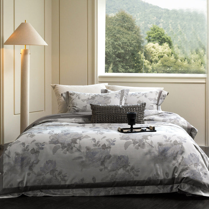 Cotton satin duvet cover set with delicate watercolor floral print, piped edge and matching pillowcases