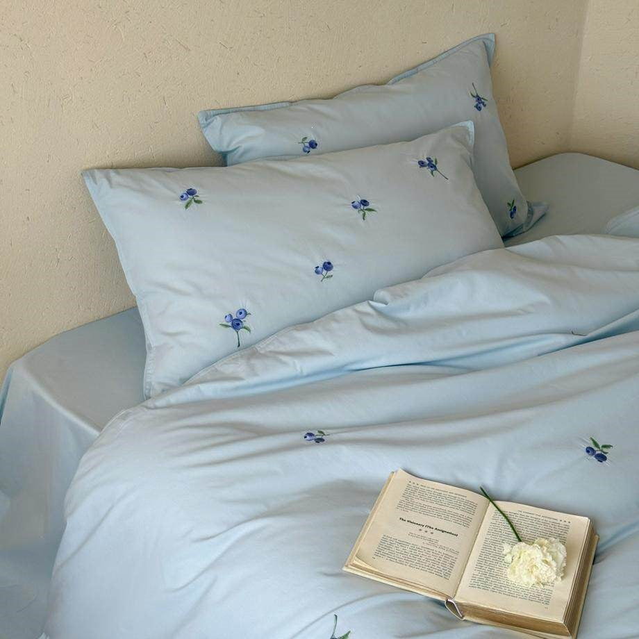 Luxurious cotton satin bedding set with delicate berry embroidery and silky-matte finish