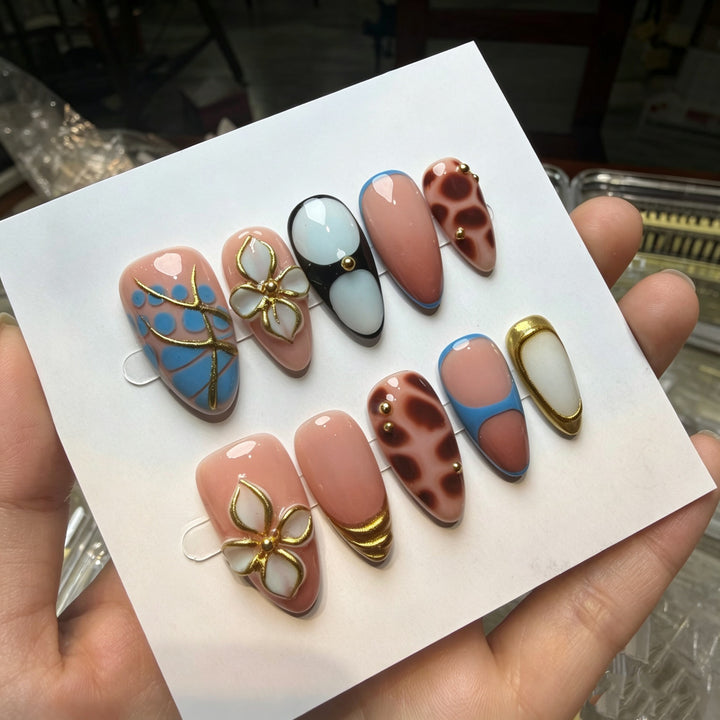 Artistic Press-On Nail Set with Floral and Green Accents