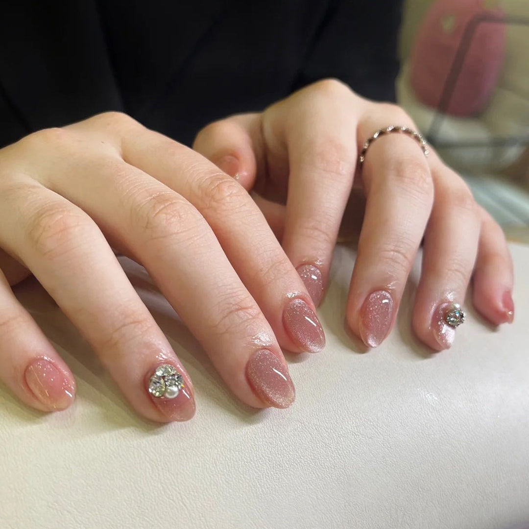 Artful glitter nail extensions with elegant rhinestone accents Kalsten