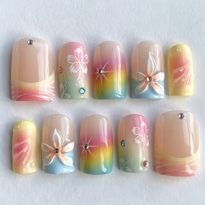 Acrylic nails with floral accents and gradient Kalsten