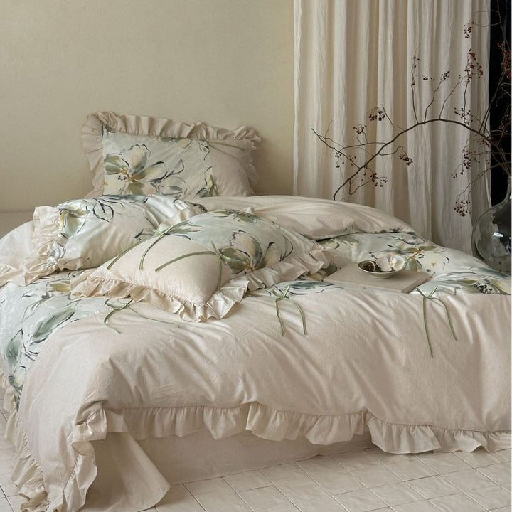 Duvet cover set made of cotton satin with watercolor magnolia print, ruffle, and tie ribbons