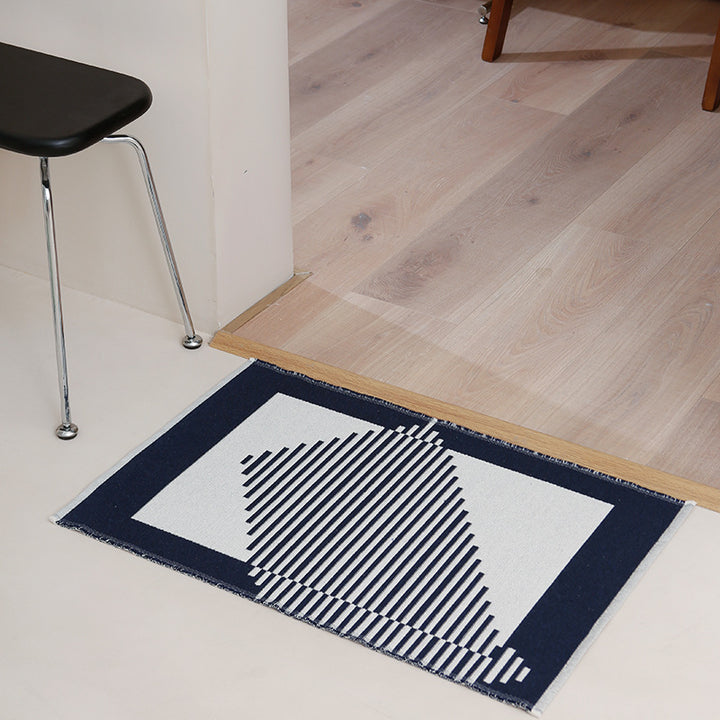 Flat-woven living room rug in a graphic tile pattern