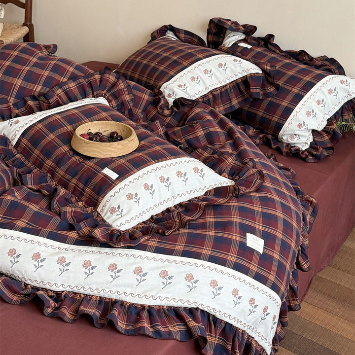 Checked bedding set in vintage cottage style with ruffle and embroidered border
