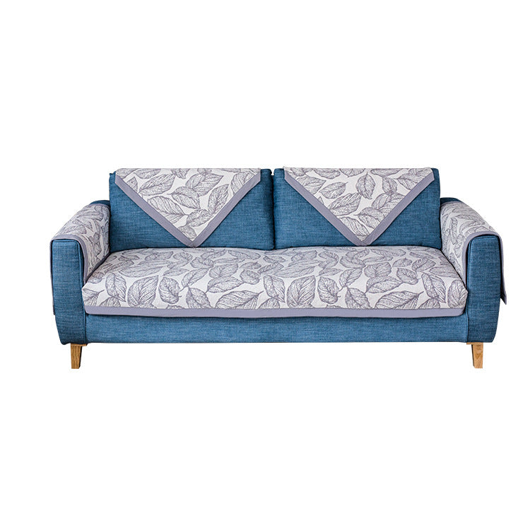 Universal sofa protective cover for three-seater with leaf print, non-slip underside and separate armrest covers Kalsten