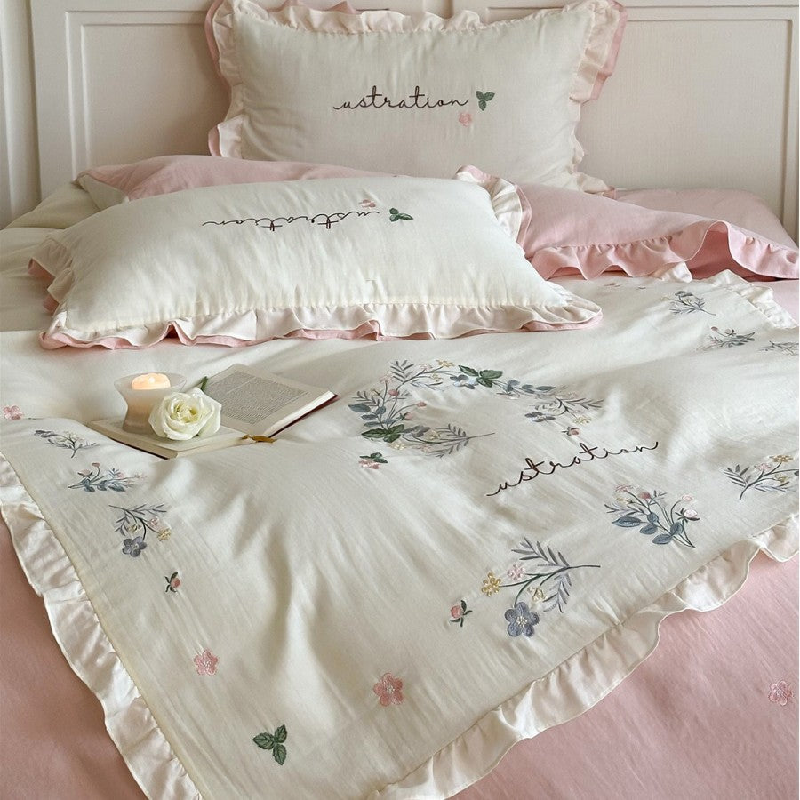Bedding set with ruffles, embroidered middle cover and delicate flower application